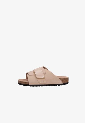 Sandalo beige scivolato con una larga fascia, chiusura in velcro, soletta in sughero e suola in gomma nera. Texture liscia con accenti delicati.