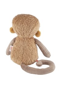 Plush monkey toy with a beige, fuzzy body, smooth arms and legs, and round yellow ears. Curled tail and small tag visible.