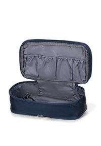 Granatowa kosmetyczka zapinana na suwak o zorganizowanej konstrukcji. Wnętrze pokryte szarym materiałem, z wieloma elastycznymi kieszeniami do organizacji.