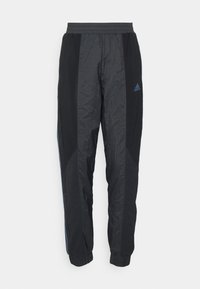 Pantalon de survêtement Adidas noir avec ceinture et poignets élastiqués, tissu léger et petit logo sur la cuisse gauche.