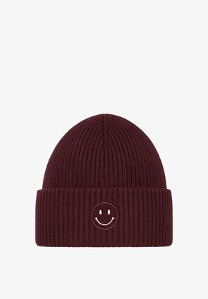 Maroon ribbed knit beanie with a folded cuff and embroidered white smiley face. Made from soft material with a textured finish.