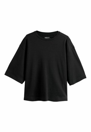 Sort cropped løstsiddende T-shirt med korte brede ærmer og rund halsudskæring, vist på hvid baggrund.