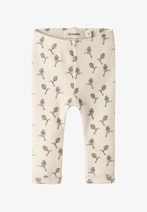 Leggings pour bébé couleur crème avec un imprimé de petites fleurs violettes et vertes sur l’ensemble et une ceinture élastique, taille 1-2 mois.