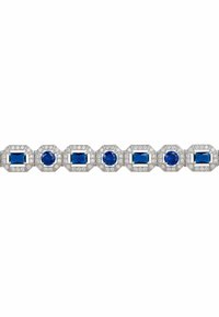 Sapphire and diamond bracelet featuring alternating octagonal and rectangular blue sapphires set in silver, with intricate diamond accents.