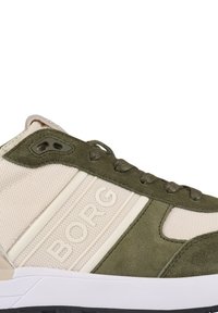 Groene en beige sneaker met een bovenwerk van textuurstof, suède accenten en opvallende logo-details aan de zijkant. Rubberen zool.