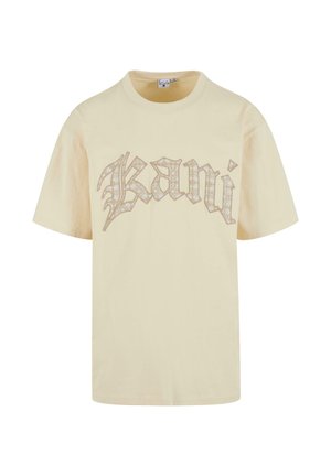 Beige cotton t-shirt featuring a large, textured, light gray "Kani" print in a stylized font. Short sleeves and crew neck design.