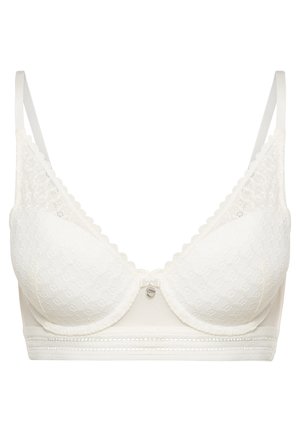 Balta nėriniuota bralette su taškiniu raštu, lygiomis puodeliais, reguliuojamomis petnešomis, grotelėmis apvadu ir dekoratyviu elementu centre.