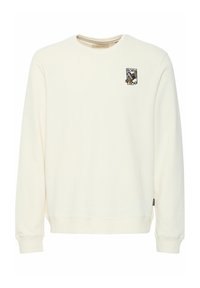 Cream-colored sweatshirt with a round neck, long sleeves, ribbed cuffs, and a small embroidered graphic featuring a bird and text on the chest.
