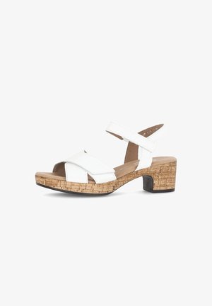 Weiße Leder-Sandale mit überkreuzten Riemen, Kork-Blockabsatz und Gummisohle. Verfügt über einen verstellbaren Knöchelriemen für einen sicheren Sitz.