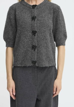 Cardigan in lana grigia con maniche a palloncino corte, caratterizzato da cinque bottoni neri a forma di fiocco in perline. Tessuto morbido con un design corto.