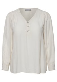 Blusa color crema con scollatura a V, tre bottoni decorativi argento sul davanti e maniche lunghe con gather e polsini aderenti. Tessuto dalla trama liscia.