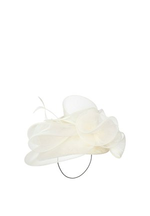 White delicate mesh fascinator hat with large twisted loops and thin feathers, secured by a thin black headband.