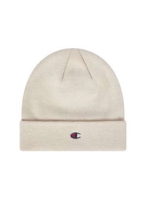 Gorro de punto beige con vuelta en el puño. Presenta un pequeño logo bordado en rojo, blanco y azul en la parte delantera. Textura suave.