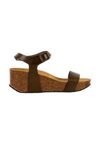 Sandale compensée en cuir marron avec une bride à la cheville, semelle intérieure en liège et semelle en caoutchouc texturé. Deux larges brides sur les orteils et le médio-pied.