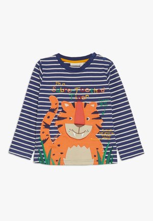 Granatowo-biała koszula w paski z długim rękawem, z grafiką uśmiechniętego pomarańczowego tygrysa i kolorowym napisem "Jestem tygrysem szablozębnym."