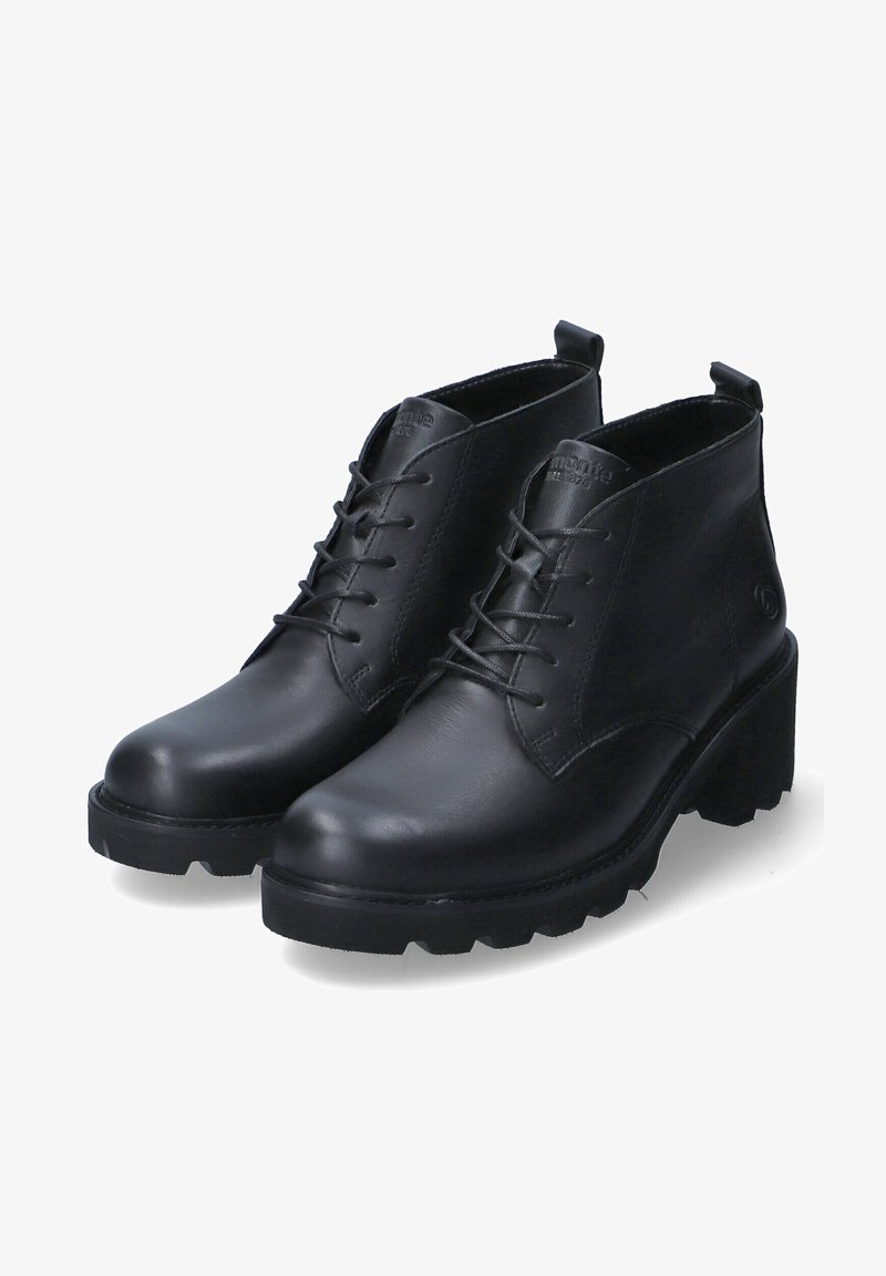 Bottes basses en cuir noir avec talons épais, à lacets sur l'avant et languettes à l'arrière, sur fond blanc.
