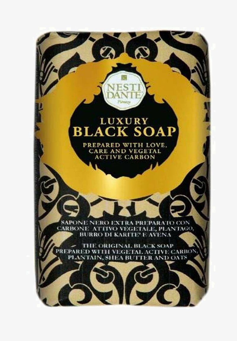 Nesti Dante Luxury Black Soap packaging with gold and black ornate design, highlighting vegetal active carbon, plantain, shea butter, and oats.