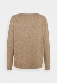 Beige knitted sweater with a rounded neckline, ribbed cuffs and hem, featuring a soft texture and a relaxed fit.
