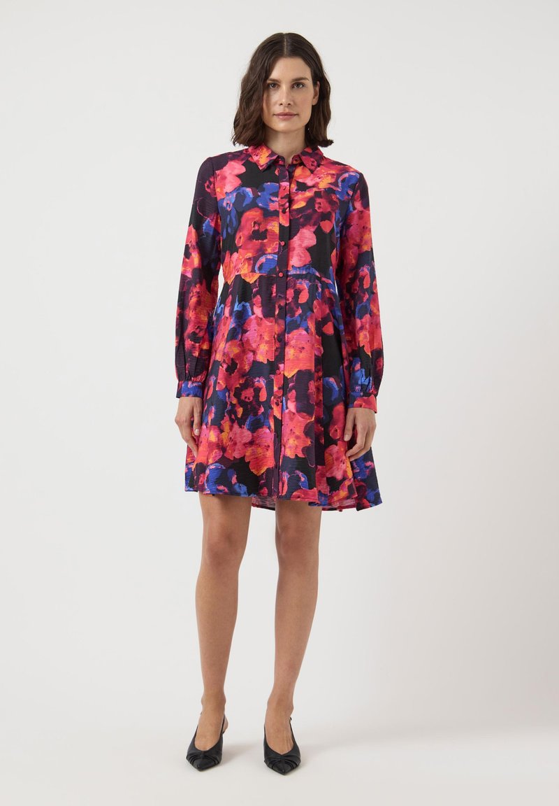Floral dress featuring vibrant pink, red, and blue colors on a black background. Long sleeves, collar, and button-down front.