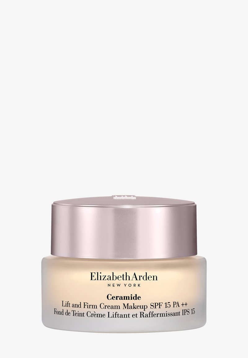 Maquillaje Elizabeth Arden Ceramide Lift and Firm Cream con SPF 15 en un tarro esmerilado y tapa reflectante en oro rosa.