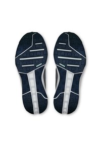 Navy running shoe soles featuring a textured grip pattern, white accents, and rubberized treads for traction and durability.