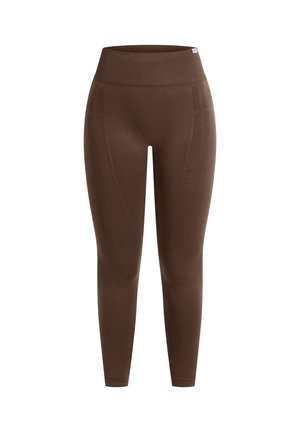 Bruine, aansluitende leggings met een hoge taille, gemaakt van een soepele, rekbare stof; biedt extra naaddetails aan de zijkanten.