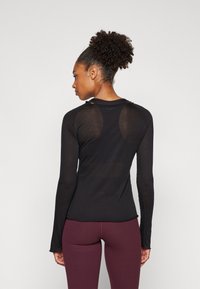 Björn Borg STUDIO LIGHT LONGSLEEVE - Top dugih rukava - black beauty