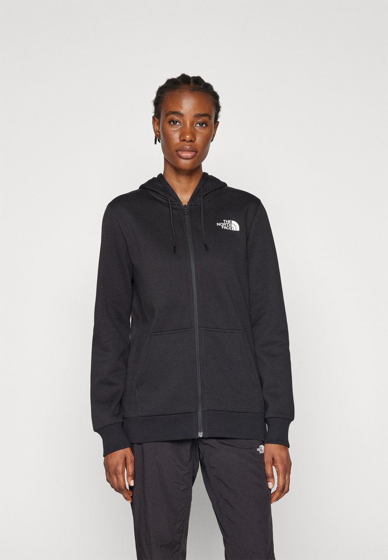 Sudadera con cremallera negra y capucha ajustable, con bolsillos frontales y el logo de The North Face impreso en el lado izquierdo del pecho. Fabricada con un tejido suave y un corte casual.