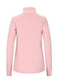 Pitkähihaine, vaaleanpunainen polo-paita korkealla kauluksella ja raglan-hihoilla, valmistettu sileästä, joustavasta kankaasta. Ei näy näkyviä logoja tai kuvioita.