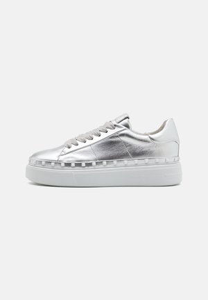Metallic silver sneakers with a smooth texture, white platform sole, and decorative studs along the sole edge; features laced front design.