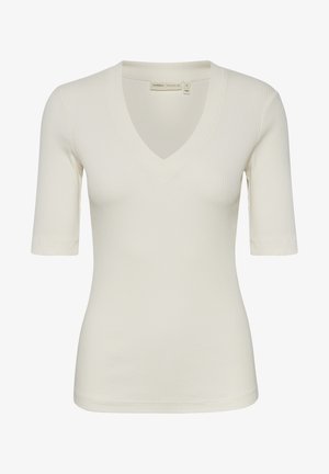 Cremefarvet ribbet t-shirt med V-hals og korte ærmer. Glat tekstur, tætsiddende facon og pæn kant. Subtile søm detaljer.