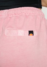 Ellesse VELAM - Calças de fato de treino - pink