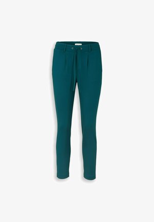 Pantalon fuselé bleu sarcelle avec taille à cordon, passants de ceinture et plis devant, présenté sur un fond blanc.