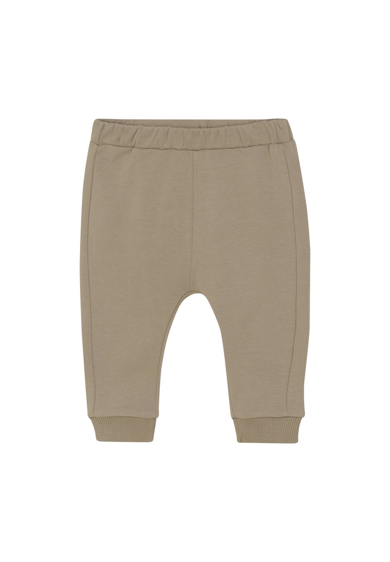 Beige Baumwoll-Jogginghosen für Kleinkinder mit einem elastischen Bund, gerippten Bündchen und seitlichen Nähten. Weiche, glatte Textur, taillierte Beinform.