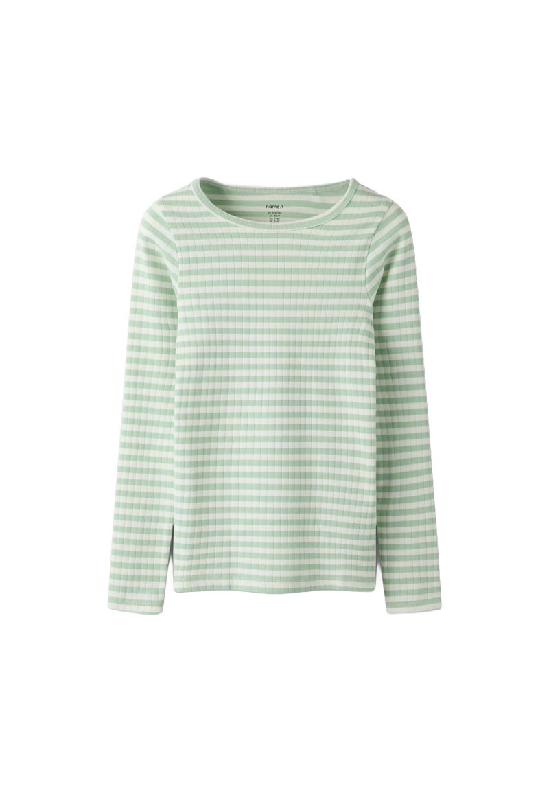 Zielona i biała bluzka w paski z długim rękawem i okrągłym dekoltem. Charakteryzuje się prążkowaną fakturą oraz bocznymi rozcięciami u dołu, zapewniającymi większą swobodę ruchów.