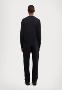 EA7 Emporio Armani UNISEX - Ilgarankovis viršutinės dalies drabužis - black