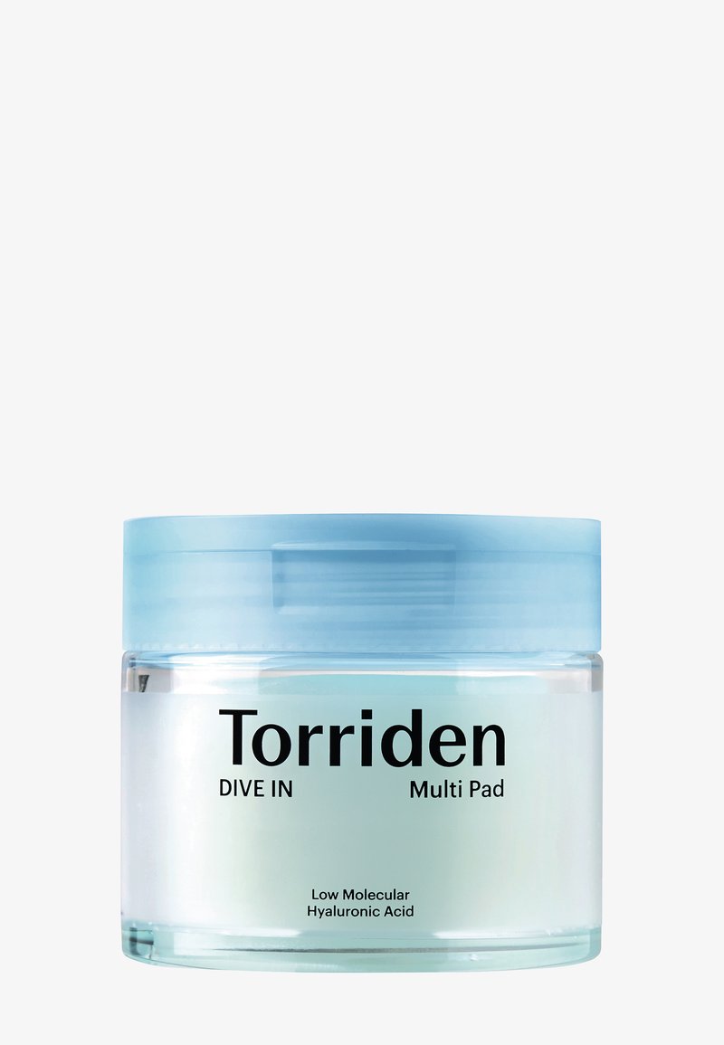 Torriden DIVE IN Multi Pad beholder, rund, klar med en lyseblå låg. Indeholder sort tekst på en hvid etiket med produktinformation nederst.