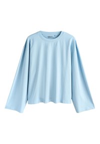 T-shirt bleu clair à manches longues avec col rond, coupe ample et design simple, présenté sur fond blanc.