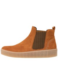 Beżowe zamszowe botki Chelsea z ryflowaną gumową podeszwą, elastycznym bocznym panelem i pętelką na pięcie, przedstawione w widoku bocznym na białym tle.