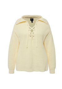 Maglione lavorato a maglia color crema con colletto e chiusura con lacci. Presenta maniche lunghe e una vestibilità rilassata, mettendo in evidenza una texture a costine.