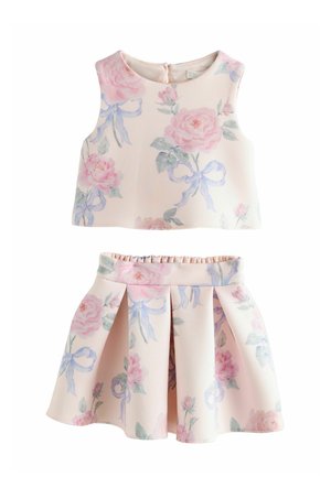 Sleeveless crop top and pleated skirt set in pale pink with large pastel floral prints and light blue ribbon designs.