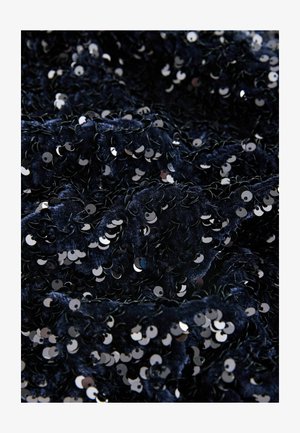 Navy textured fabric adorned with overlapping metallic sequins, creating a shimmering effect. Soft to the touch with a dense appearance.