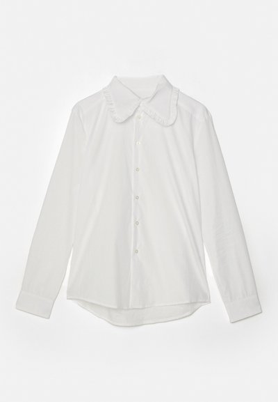 White long-sleeve shirt with a ruffled collar, front button closure, and a curved hem. Smooth texture and no visible patterns.