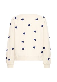 Felpa crema con ricamo a forma di cuore blu navy, polsini a coste e scollatura rotonda. Tessuto morbido con vestibilità comfort.