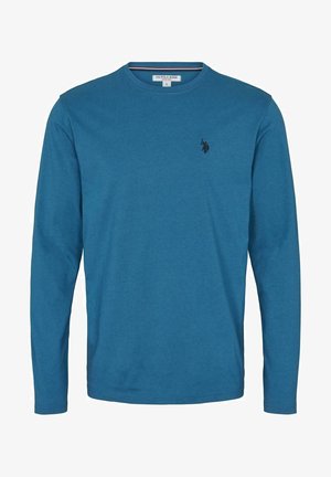 Tričko s dlouhým rukávem z živě modré bavlny, kulatý výstřih, na hrudi malý černý logo a hladká textura.