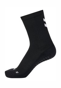 Czarna sportowa skarpeta z teksturowanym wzorem. Posiada wzmocniony palec, wyściełaną podeszwę oraz białe detale logo po boku.