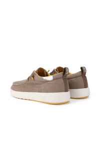 Brown fabric sneakers with a smooth texture, white accents, yellow laces, and a rubber sole; features a pull tab on the heel for easy wear.