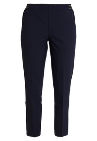 Navyblå skräddarsydda byxor i ett slätt tyg med smal passform, med sidofickor och subtila metalliska accentränder vid midjan.