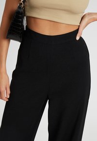 TUSSAH MILLY  - Nohavice - black