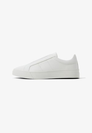 Low-profile white slip-on sneaker with padded collar, subtle stitching accents, and thick rubber sole, shown in side view on a white background.